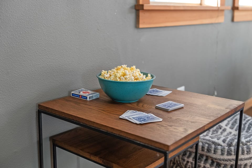 Game table with board games and snacks for indoor entertainment