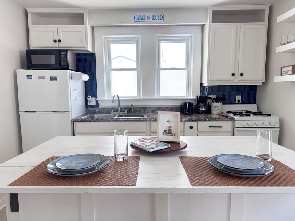 Fully stocked kitchen with bar seating for 2.