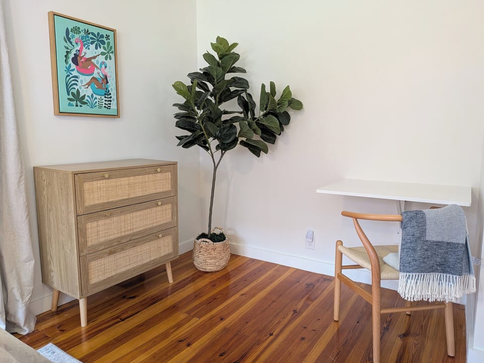 This corner provides a dedicated workspace with a sleek, collapsible desk.