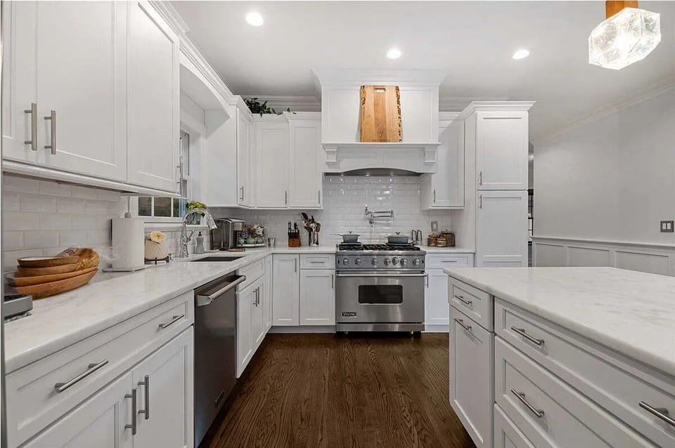 Chef's kitchen with quartzite counters and Viking appliances throughout.