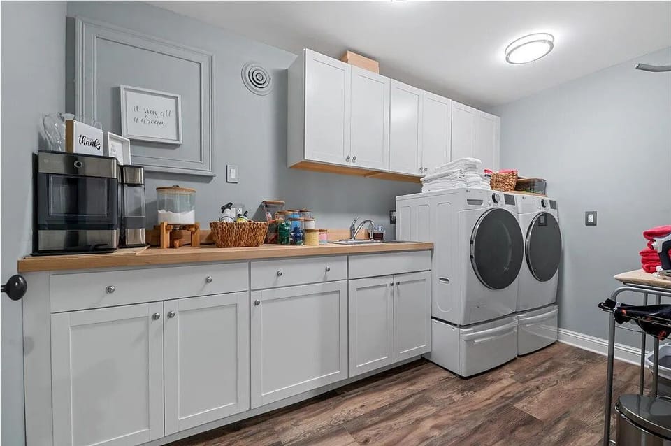Full-size washer and dryer with counter space for longer stays.Laundry room