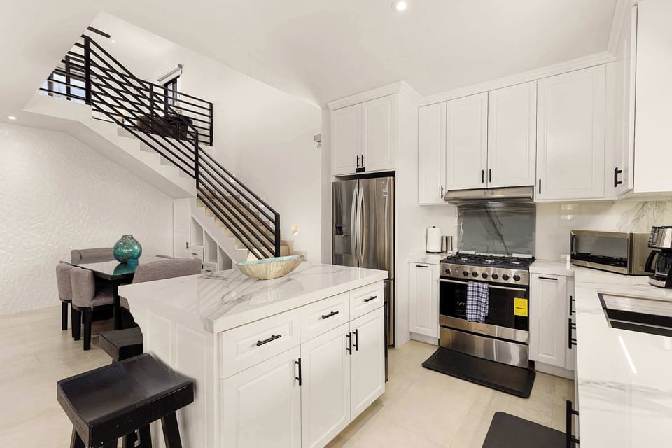Fully equipped modern kitchen for home-cooked meals during your stay.