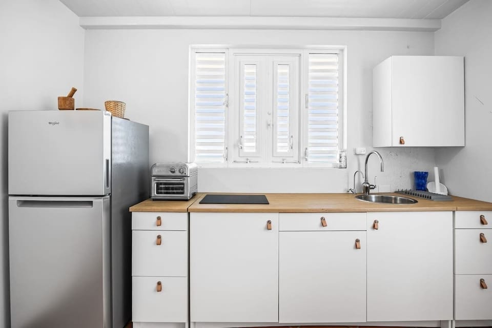 A well-equipped kitchen for light cooking.