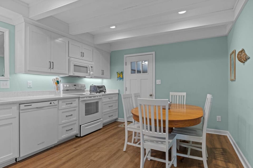 Enjoy cooking and dining in this bright kitchen with modern appliances and seating area