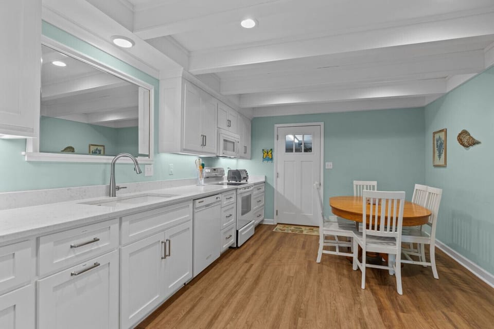 Bright kitchen with cozy breakfast table—perfect for casual dining and morning coffee