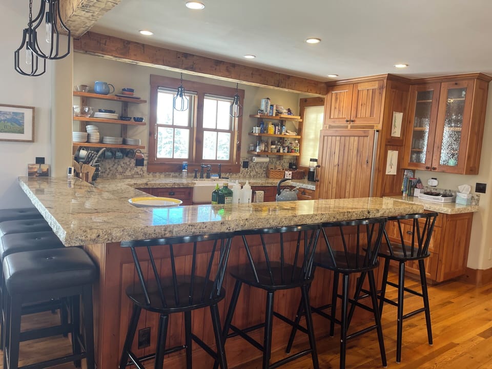 Fully equipped kitchen with modern appliances and ample counter space  