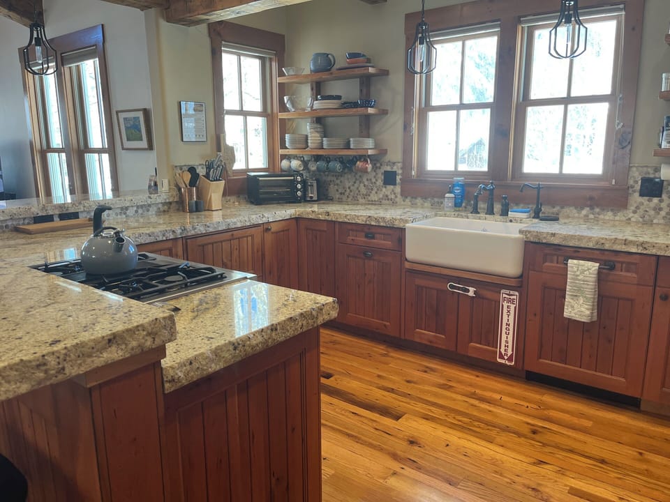 Fully equipped kitchen with modern appliances and ample counter space  
