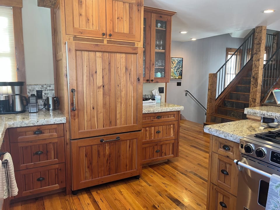Fully equipped kitchen with modern appliances and ample counter space  