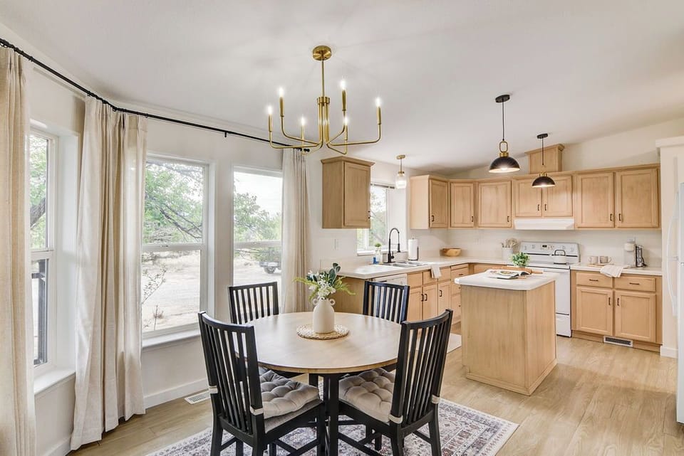 The bright spacious kitchen offers plenty of room to cook and enjoy meals.
