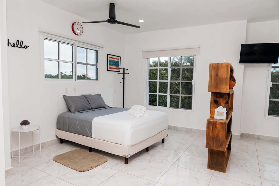 This accommodation features two double beds and a sofa bed.