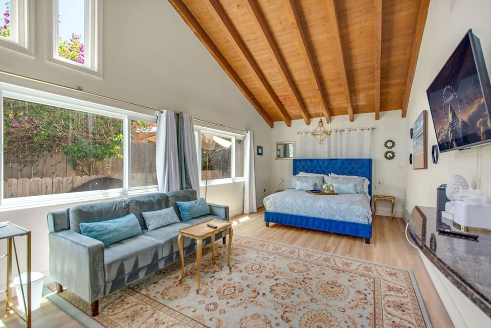 Retreat to the spacious king bedroom, complete with a couch, Smart TV, and desk for work or study.