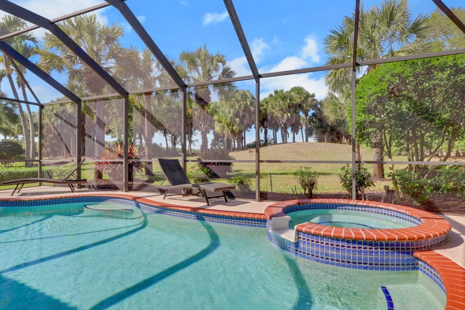 The highlight of the home is the fully screened lanai, where you can swim in the private heated pool, relax in the spa, or lounge in the Florida sun.