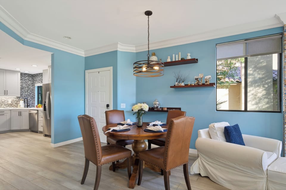Dining area featuring a round table and seating for four.