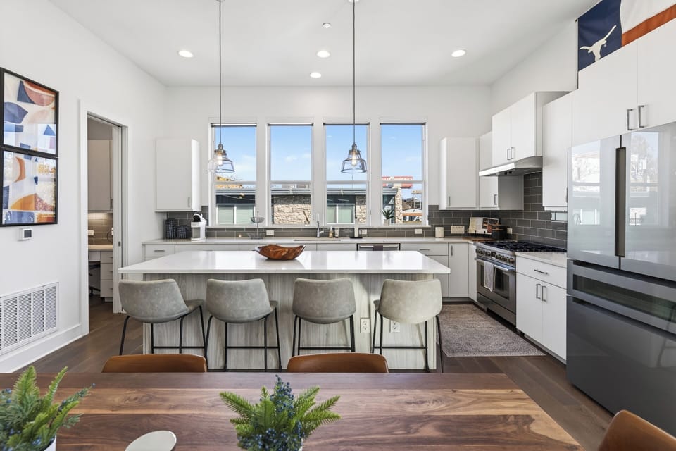 Close-up of the kitchen island and high-end stainless steel appliances.