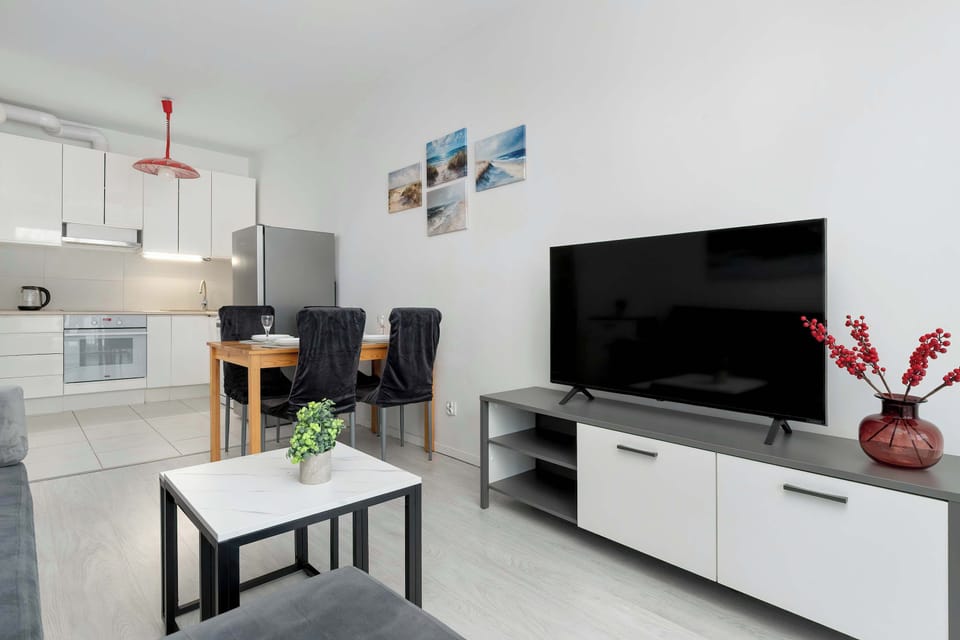 Comfortable living room with a TV area and tasteful decorative accents.