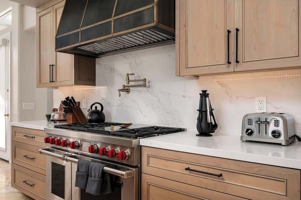 You'll love creating culinary masterpieces in this stunning gourmet kitchen with professional-grade appliances and elegant marble backsplash.
