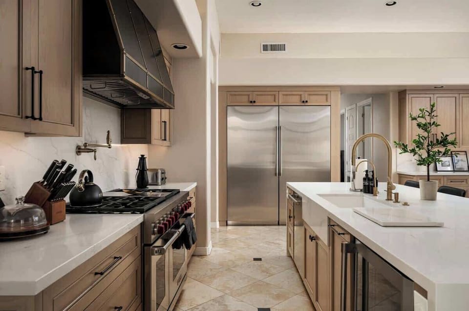 Your gourmet kitchen awaits with premium stainless steel appliances, marble countertops, and professional-grade cookware ready for culinary adventures.
