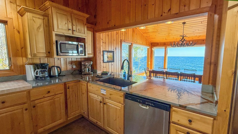 Enjoy Lake Superior views while preparing a meal in the kitchen.