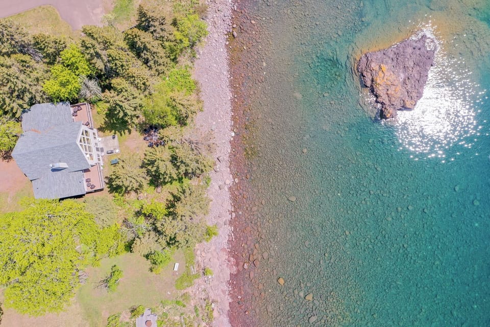 The home is very close to its private Lake Superior beach.