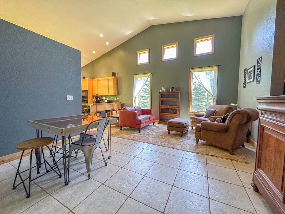 There is a sitting room and a breakfast table off of the kitchen.
