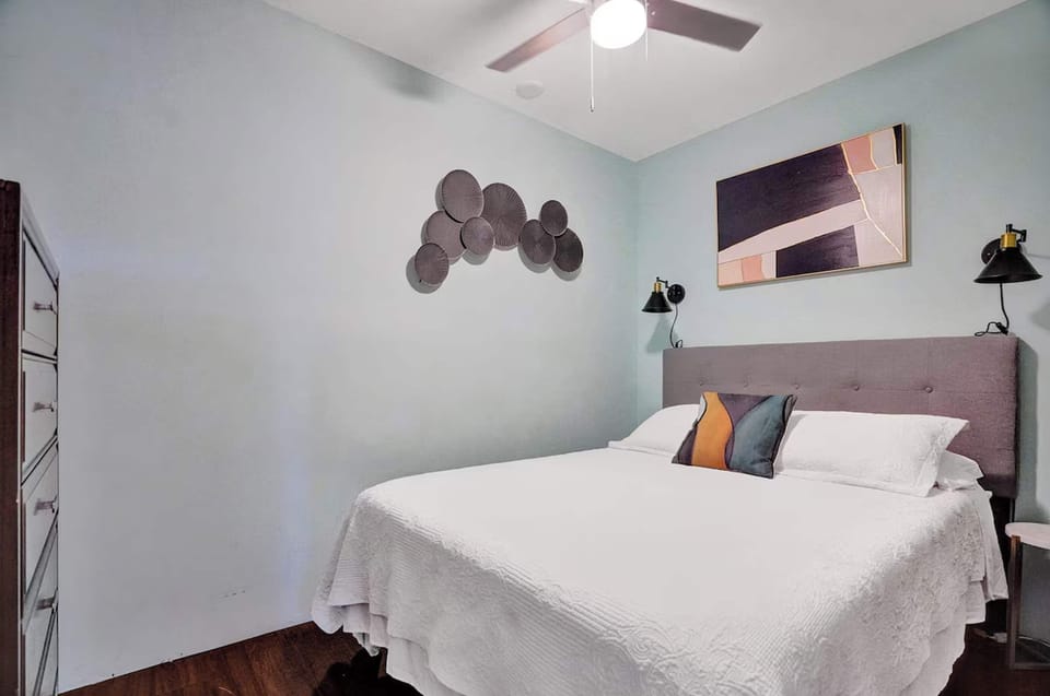 Recharge in the bedroom, offering a plush king bed & smart TV​