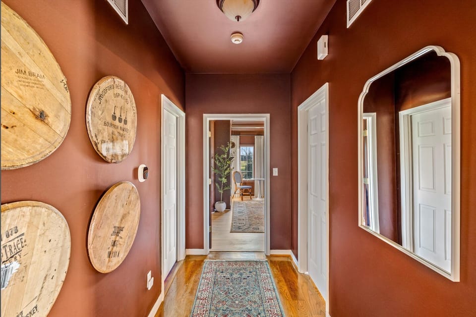 Distillery-themed hall: Your gateway to the master suite and PS5 lounge.