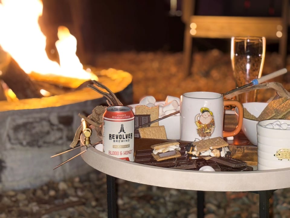 Fire Pit Delight: Indulge in s'mores under the stars with a refreshing drink in hand!