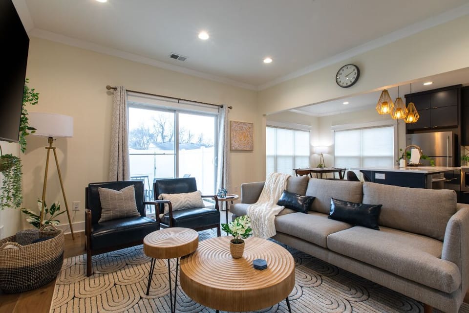 Spacious living room with seating and patio access