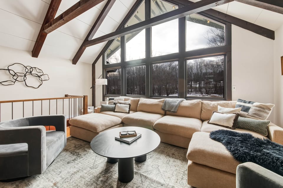 Spacious living room with vaulted ceilings and cozy fireplace