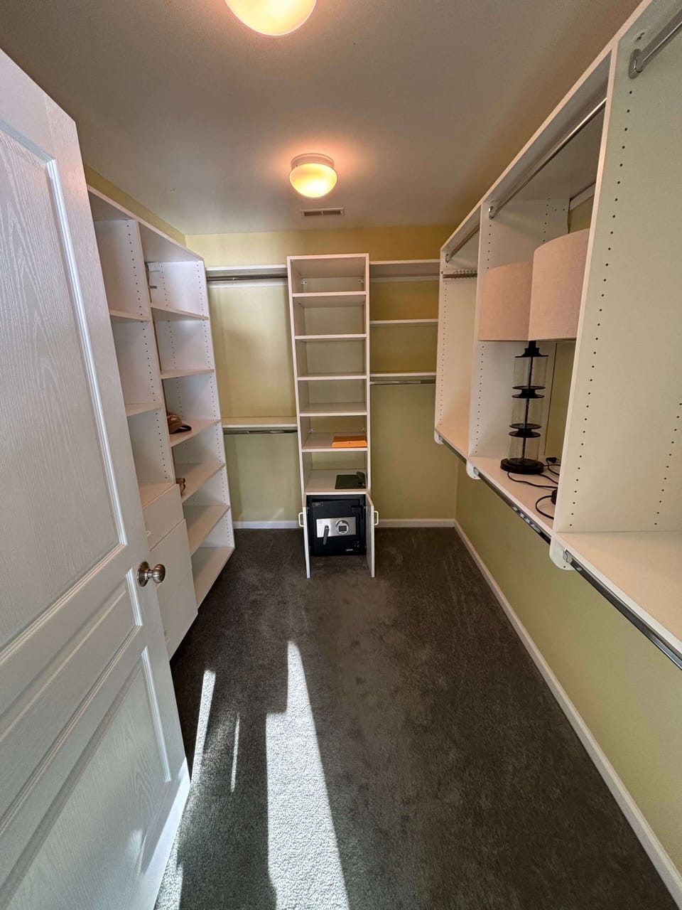 Walk-in closet for primary bedroom.  New paint and carpet not shown.