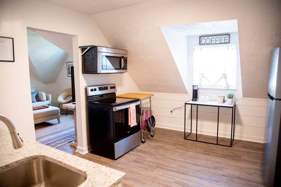 Calming Terracotta Chateau - Kitchen with stainless steel appliances and coffee area. Coffee machine takes K-cups.