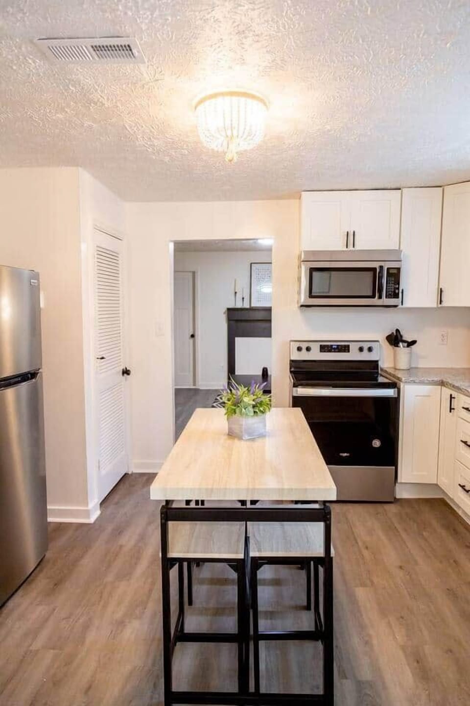 Sage Green Getaway - In kitchen dining area that can double as extra counter space when not used for dining purposes.