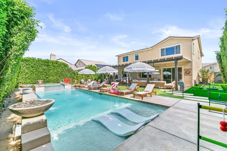 Full view of the spacious backyard retreat and modern home exterior
