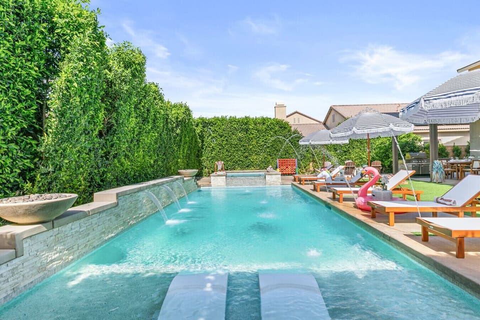 Your private oasis awaits with luxurious poolside seating, playful inflatables, and cascading fountains for a picture-perfect getaway