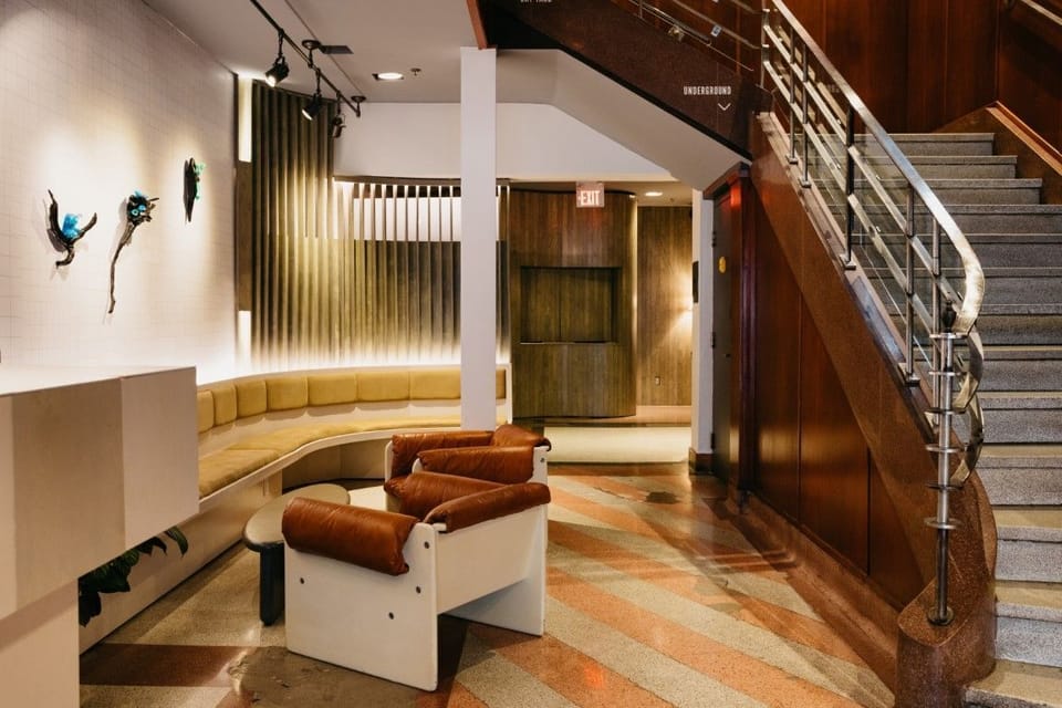 The Drake Hotel's unique staircase area blends contemporary design with artistic accents, exemplifying the hotel’s creative atmosphere.