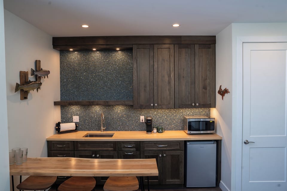 Eagle’s Nest Kitchenette with semi-stocked mini fridge, microwave, and Keurig.