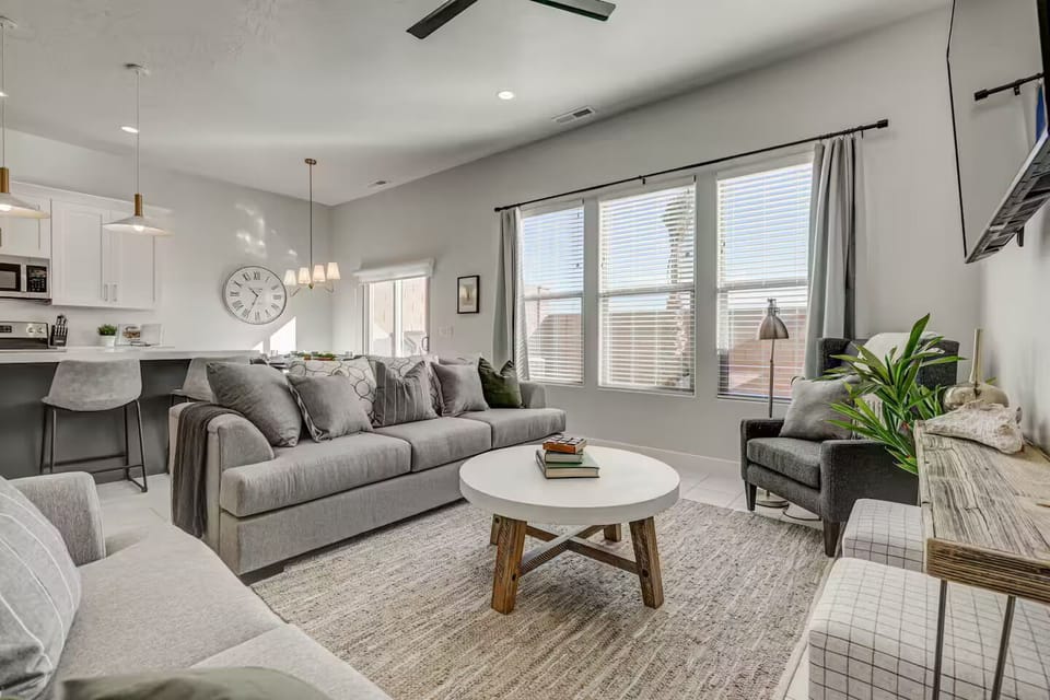 Large main level living area allow groups to be easily gather with plenty of seating and large windows with natural light. 