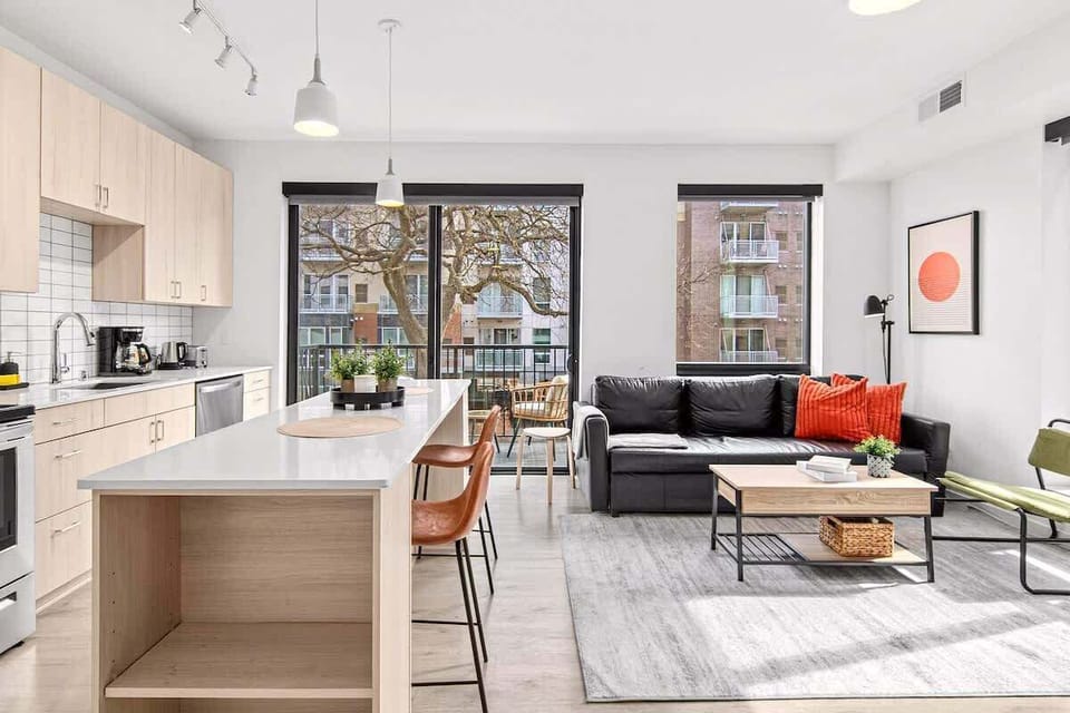 Open-concept layout connecting the living room and kitchen — ideal for socializing while cooking or enjoying a meal.