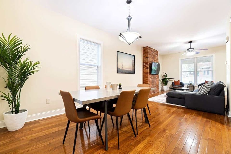Charming dining space with a modern table setup and warm lighting — perfect for shared meals or morning coffee.