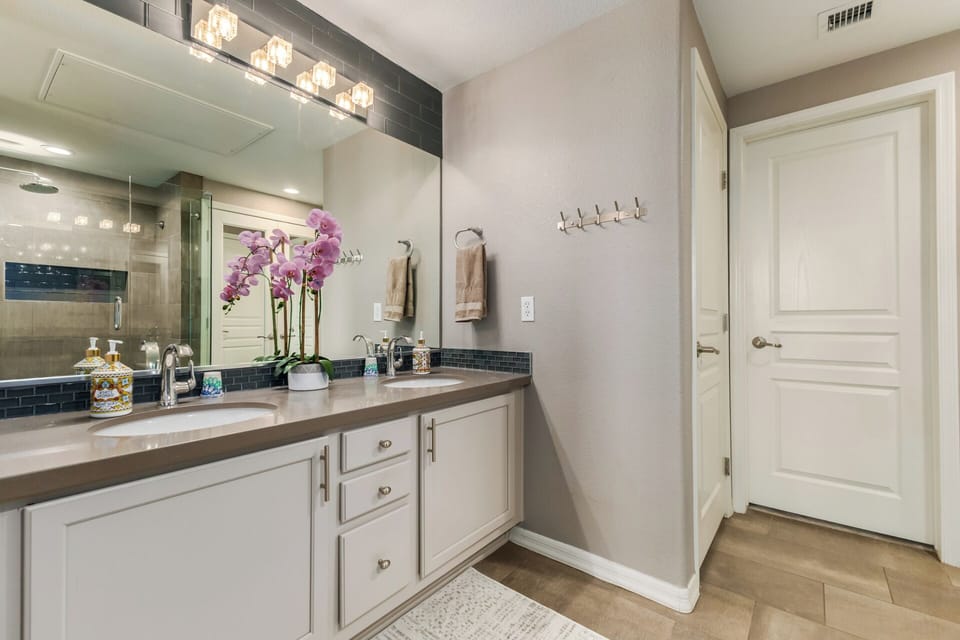 Double the vanity, double the relaxation in this sleek master ensuite.