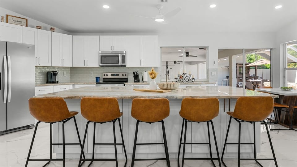Five comfy barstools at the island—perfect for coffee or cocktails
