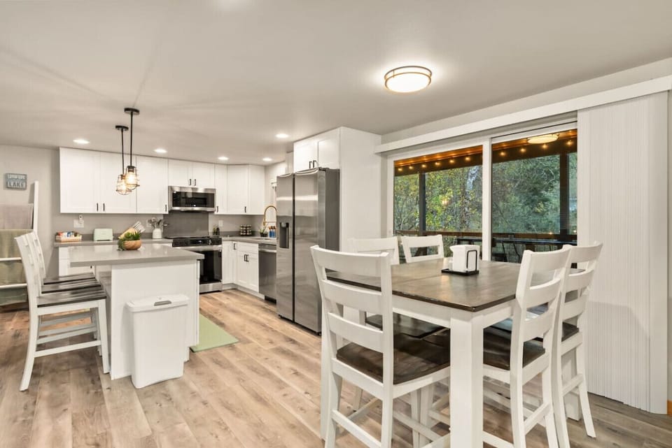 Dine indoors or step out to the deck for fresh-air meals!  Easy access from Kitchen/Dining Area to covered back deck!