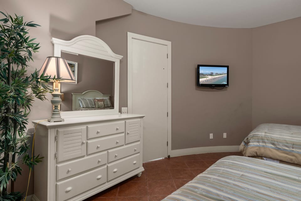 Guest bedroom featuring ful size beds and flat screen TV