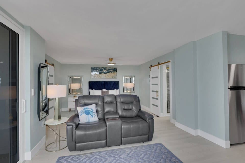 A powered reclining loveseat in the living area is perfect for relaxing after a day in the sun.