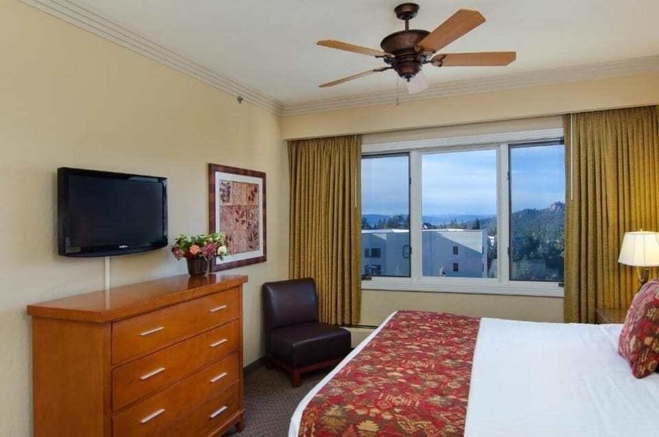 Unwind with mountain views and a cozy, classic bed.