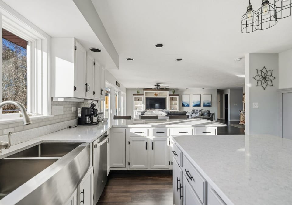 Wide-angle view showcasing the open layout and seamless flow for cooking and entertaining.