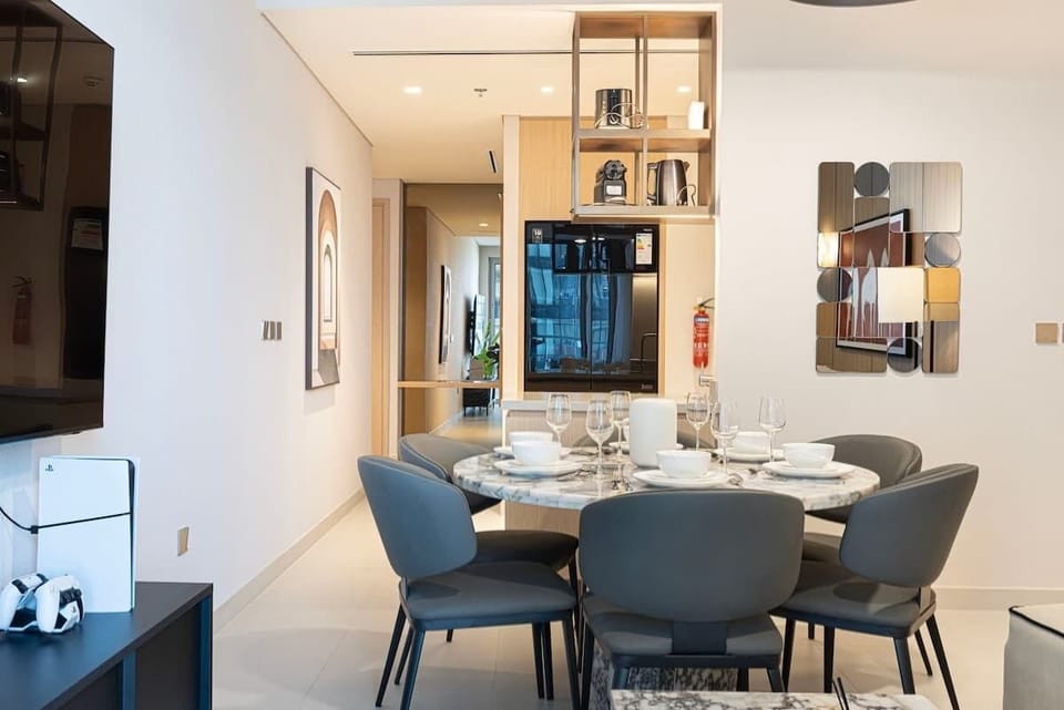 Dining area designed for shared meals, flowing effortlessly into a kitchen