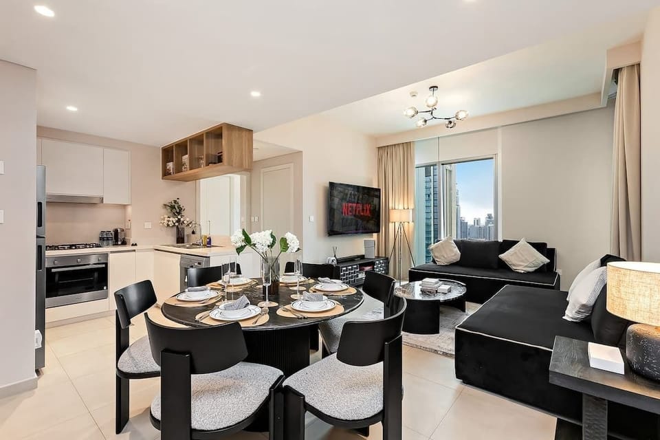 Bright dining area perfect for family meals, seamlessly connected to an open kitchen with a gas stove and oven