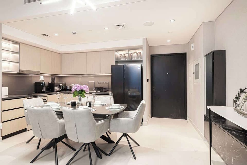 Share meals in the dining area while taking in living room views and the sparkling city skyline beyond large windows