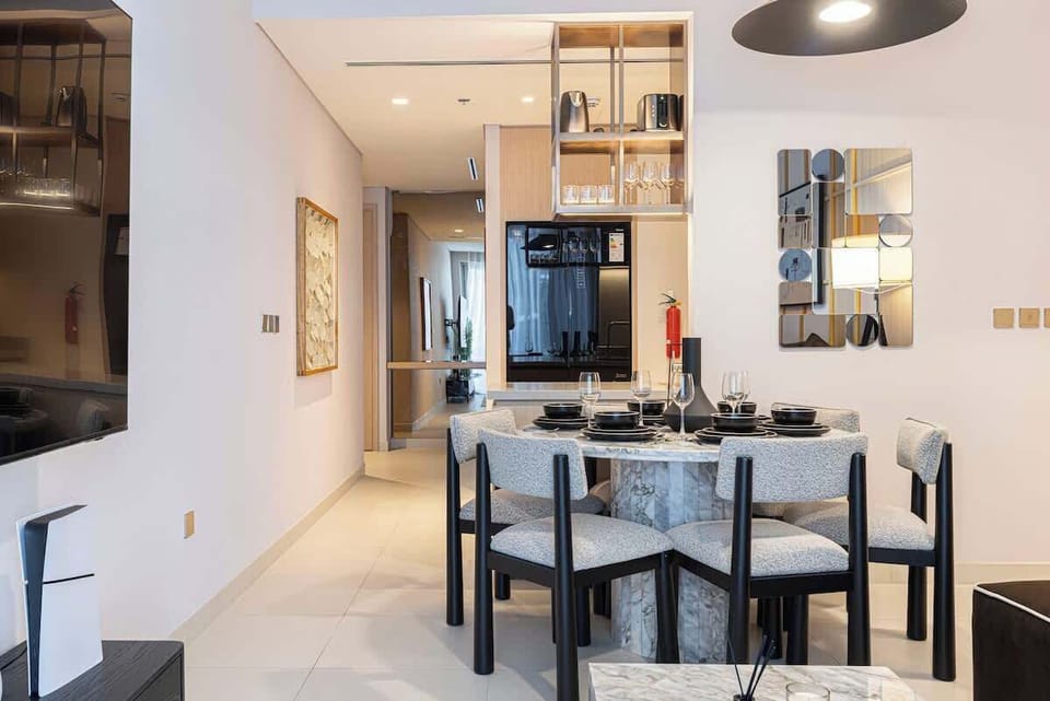 This open dining area feels expansive and connected, perfect for lively conversations and shared meals in a light-filled environment
